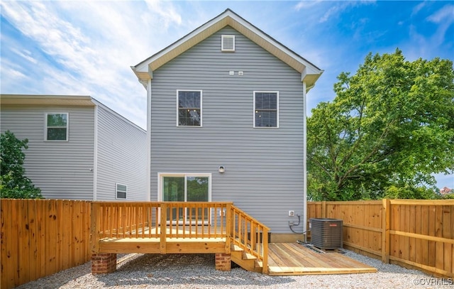back of house with a fenced backyard, cooling unit, and a wooden deck
