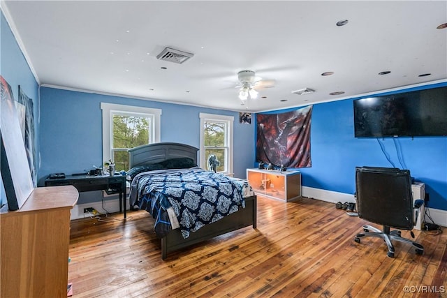 1016 Court St, Victoria, VA 23974 - bedroom with crown molding, visible vents, and hardwood / wood-style flooring