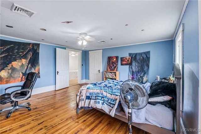 1016 Court St, Victoria, VA 23974 - bedroom featuring wood-type flooring, visible vents, baseboards, and ornamental molding