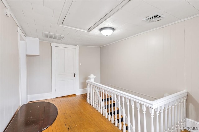 1016 Court St, Victoria, VA 23974 - corridor featuring light wood-style floors, an upstairs landing, visible vents, and attic access