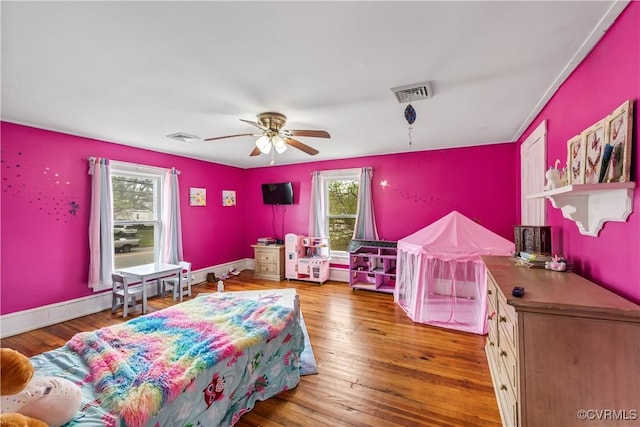 1016 Court St, Victoria, VA 23974 - bedroom with visible vents, hardwood / wood-style floors, and a ceiling fan