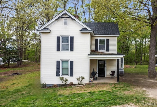1016 Court St, Victoria, VA 23974 - traditional home with a front yard, a patio, and roof with shingles