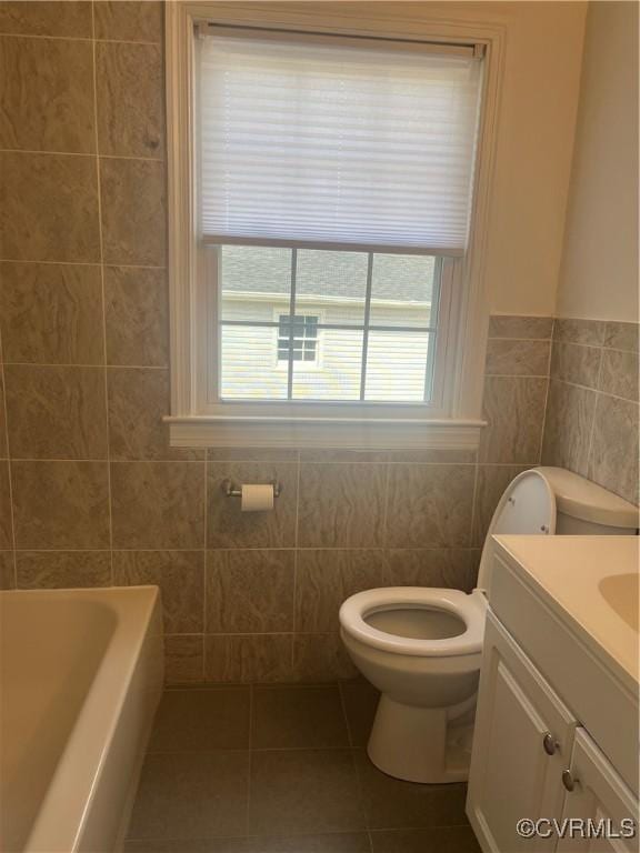 309 Royal Oak Ave, Colonial Heights, VA 23834 - full bath featuring tile walls, vanity, a bath, tile patterned floors, and a wainscoted wall