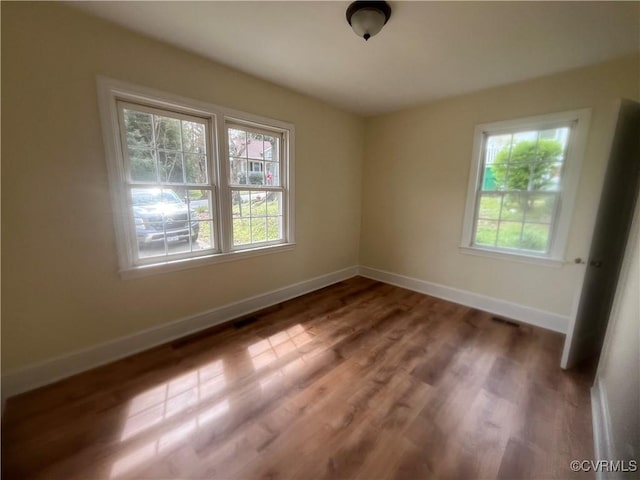 309 Royal Oak Ave, Colonial Heights, VA 23834 - unfurnished room with plenty of natural light and wood finished floors