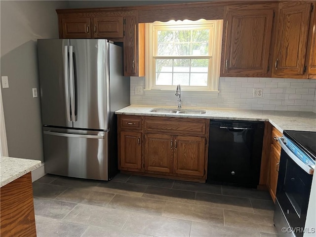 309 Royal Oak Ave, Colonial Heights, VA 23834 - kitchen with freestanding refrigerator, black dishwasher, range with electric stovetop, tasteful backsplash, and brown cabinets