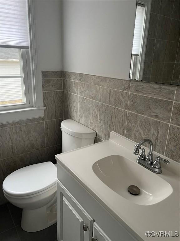 309 Royal Oak Ave, Colonial Heights, VA 23834 - bathroom with tile walls, vanity, and wainscoting