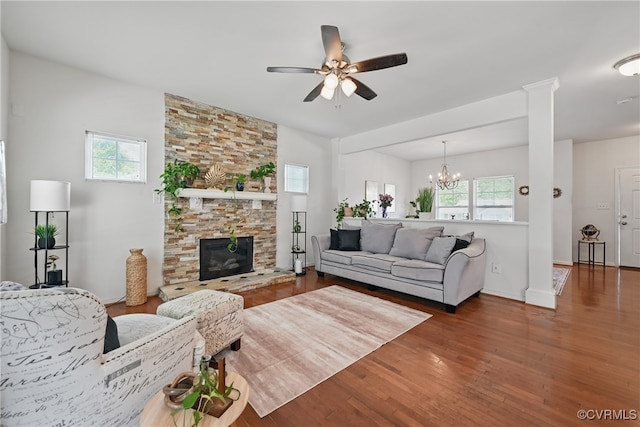11418 Parrish Creek Ln, Chesterfield, VA 23832 - living room featuring wood finished floors, ceiling fan, a fireplace, and a chandelier