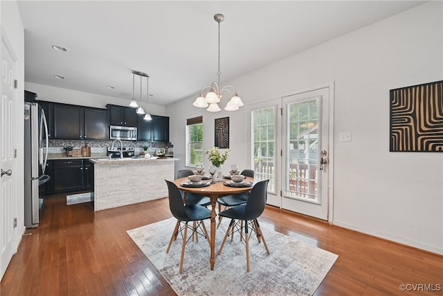 11418 Parrish Creek Ln, Chesterfield, VA 23832 - dining space with dark wood finished floors, a chandelier, and recessed lighting