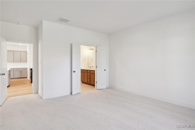124 Steyland St, Ashland, VA 23005 - unfurnished bedroom with light colored carpet, ensuite bathroom, and baseboards