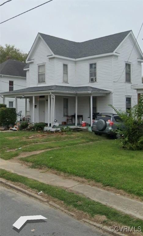 213 Park Ave, Emporia, VA 23847 - view of property with covered porch and a front lawn