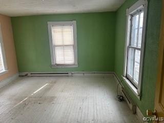 213 Park Ave, Emporia, VA 23847 - spare room featuring baseboards and baseboard heating