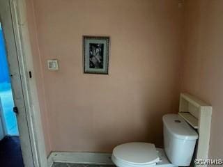 213 Park Ave, Emporia, VA 23847 - bathroom with baseboards and toilet