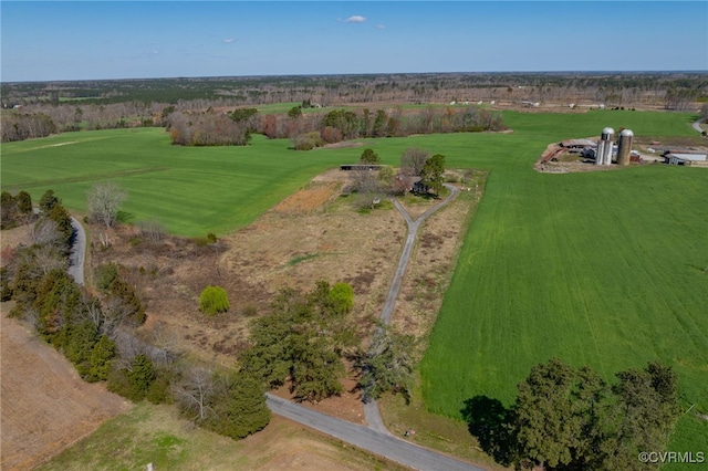 birds eye view of property with a rural view
