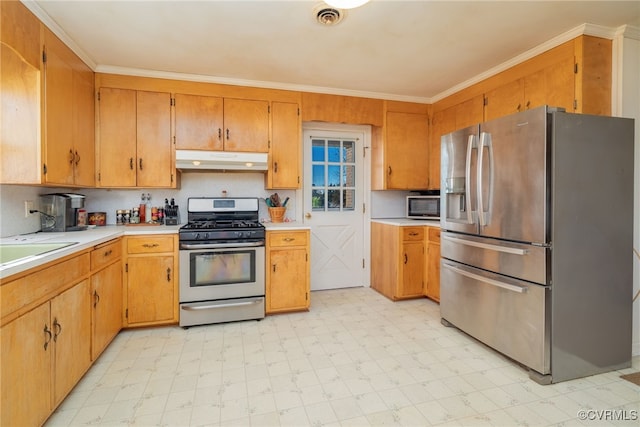 kitchen with light countertops, under cabinet range hood, visible vents, appliances with stainless steel finishes, and light floors