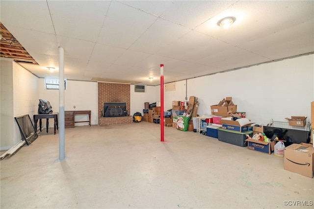 finished basement featuring concrete block wall