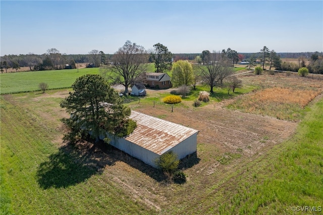 birds eye view of property with a rural view