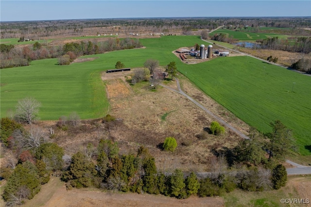 birds eye view of property with a rural view