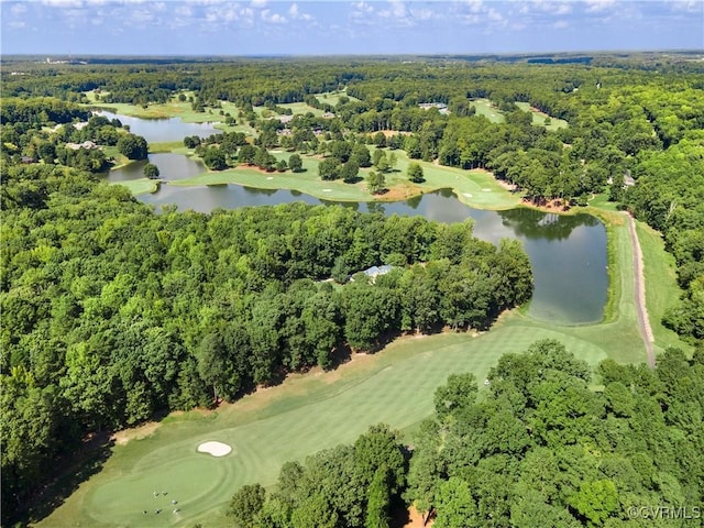 aerial view with a water view, a view of trees, and golf course view