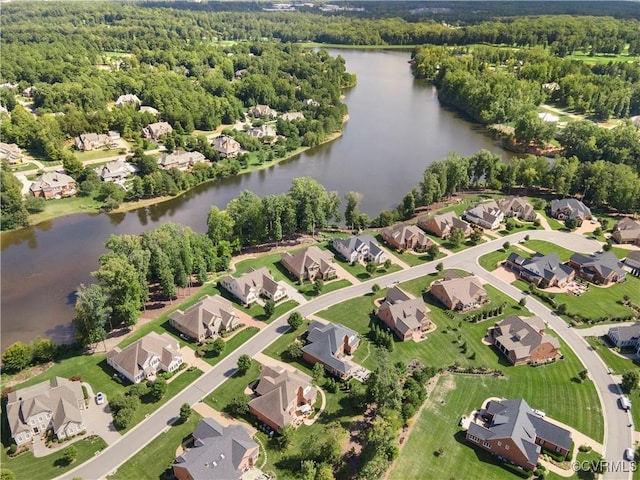 aerial view with a water view, a residential view, and a wooded view