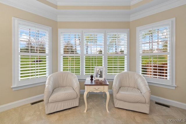 living area featuring ornamental molding, visible vents, and a healthy amount of sunlight
