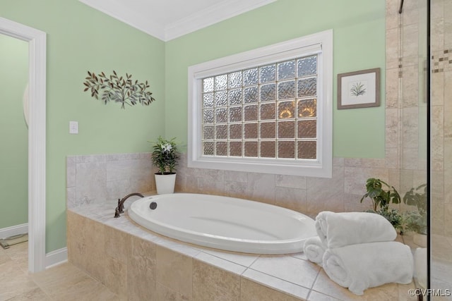full bathroom with a garden tub and crown molding