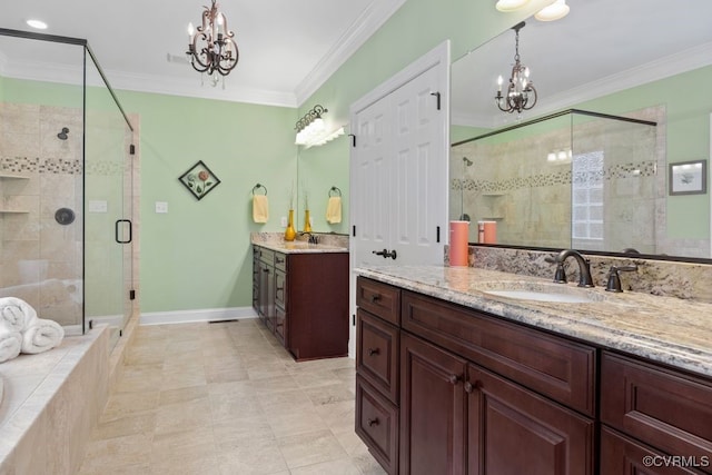 full bathroom with a shower stall, a notable chandelier, a sink, and crown molding