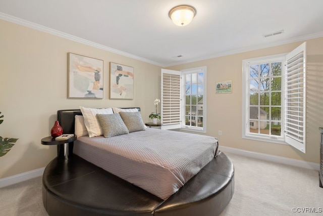 bedroom with light carpet, crown molding, and baseboards
