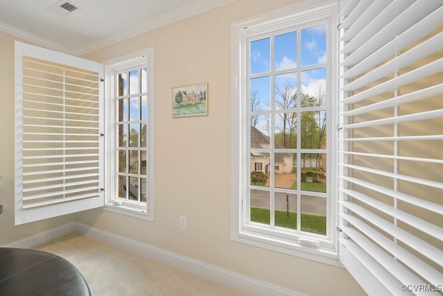 doorway featuring carpet flooring, visible vents, baseboards, and ornamental molding