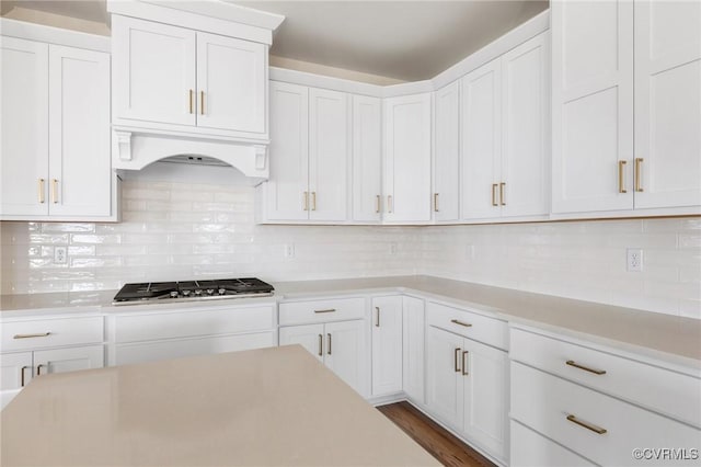 kitchen with white cabinetry, stainless steel gas cooktop, and light countertops