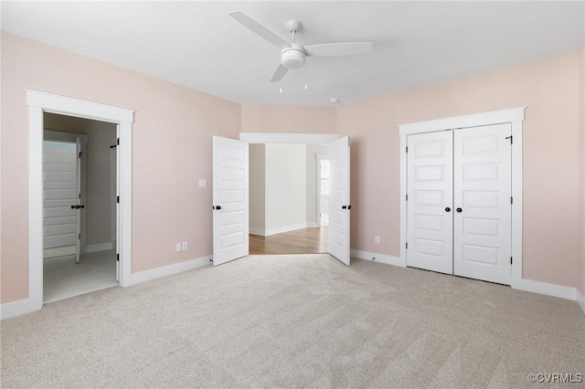 unfurnished bedroom with baseboards, a closet, and carpet