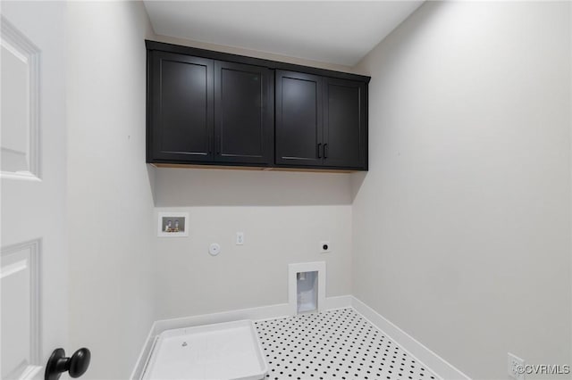 laundry room with gas dryer hookup, hookup for a washing machine, baseboards, hookup for an electric dryer, and cabinet space