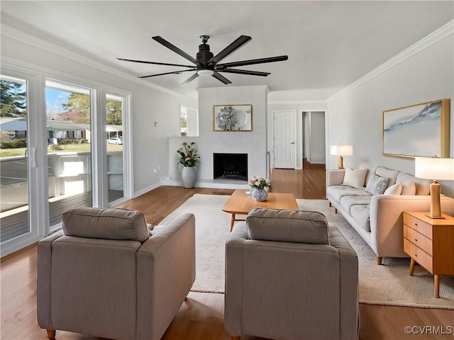 201 Winston Ave, Colonial Heights, VA 23834 - living room featuring wood finished floors, a ceiling fan, crown molding, a large fireplace, and baseboards