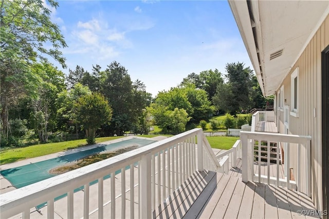 201 Winston Ave, Colonial Heights, VA 23834 - wooden terrace with an outdoor pool, a lawn, and view of wooded area