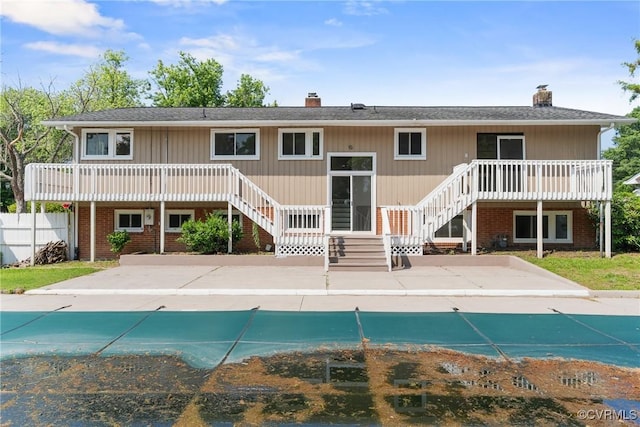 201 Winston Ave, Colonial Heights, VA 23834 - back of house with a chimney, stairway, and a covered pool