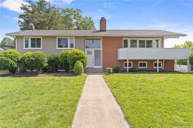 201 Winston Ave, Colonial Heights, VA 23834 - bi-level home featuring a chimney and a front yard