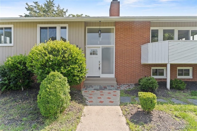 201 Winston Ave, Colonial Heights, VA 23834 - property entrance with a chimney and brick siding
