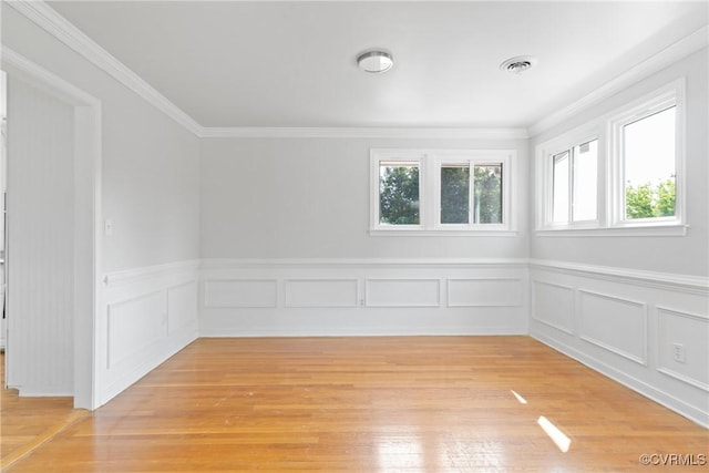 201 Winston Ave, Colonial Heights, VA 23834 - spare room featuring light wood-style flooring, crown molding, wainscoting, and a decorative wall
