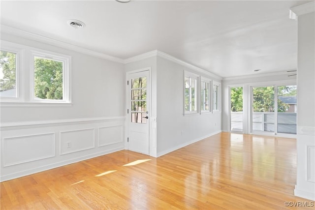201 Winston Ave, Colonial Heights, VA 23834 - unfurnished room with plenty of natural light, light wood-style flooring, crown molding, and wainscoting
