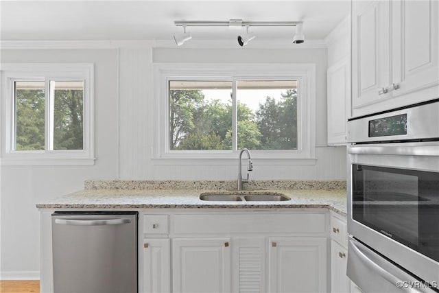 201 Winston Ave, Colonial Heights, VA 23834 - kitchen featuring stainless steel appliances, a sink, a warming drawer, white cabinetry, and light stone counters