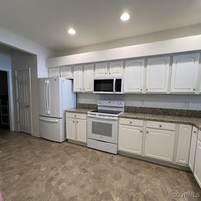 2566 Wanstead Ct, Richmond, VA 23238 - kitchen featuring recessed lighting, dark stone counters, white cabinetry, and white appliances