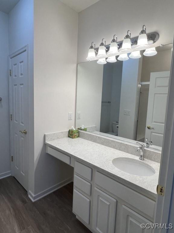 2566 Wanstead Ct, Richmond, VA 23238 - full bath with toilet, baseboards, wood finished floors, and vanity