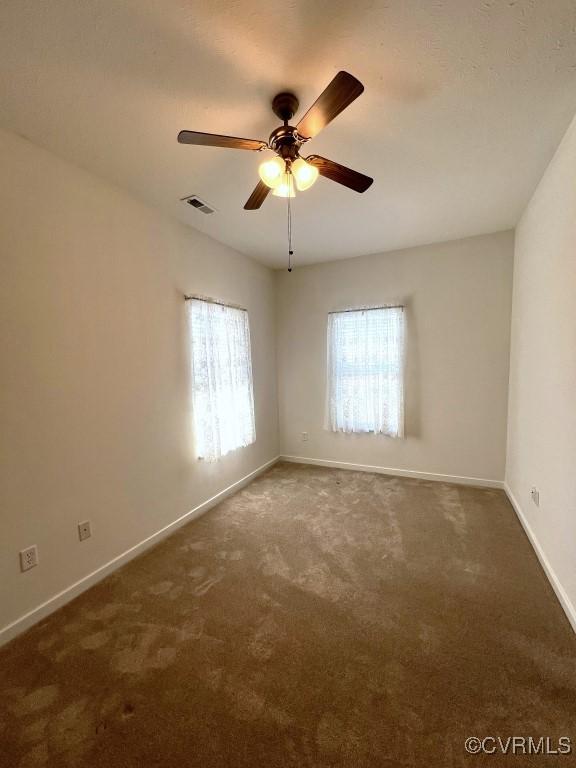 2566 Wanstead Ct, Richmond, VA 23238 - spare room with carpet floors, ceiling fan, visible vents, and baseboards