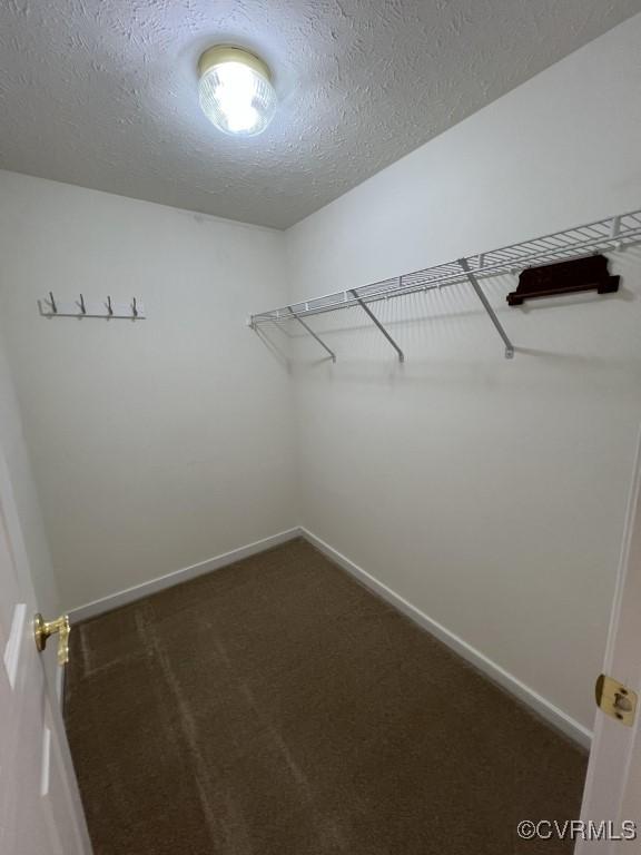 2566 Wanstead Ct, Richmond, VA 23238 - walk in closet featuring dark carpet