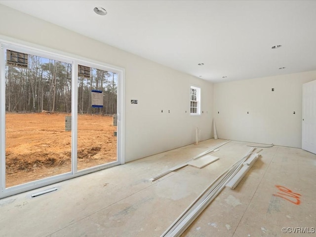 spare room with plenty of natural light