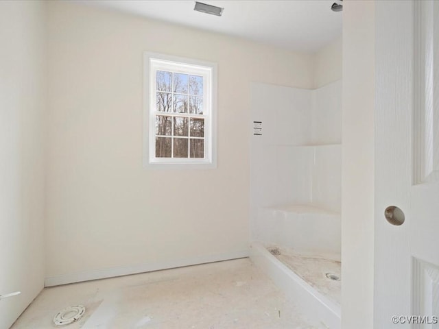 full bath with baseboards and walk in shower