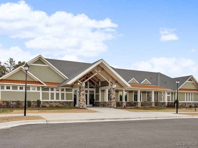18525 Cove Creek Dr, Moseley, VA 23120 - view of front of house with a standing seam roof, metal roof, and stone siding