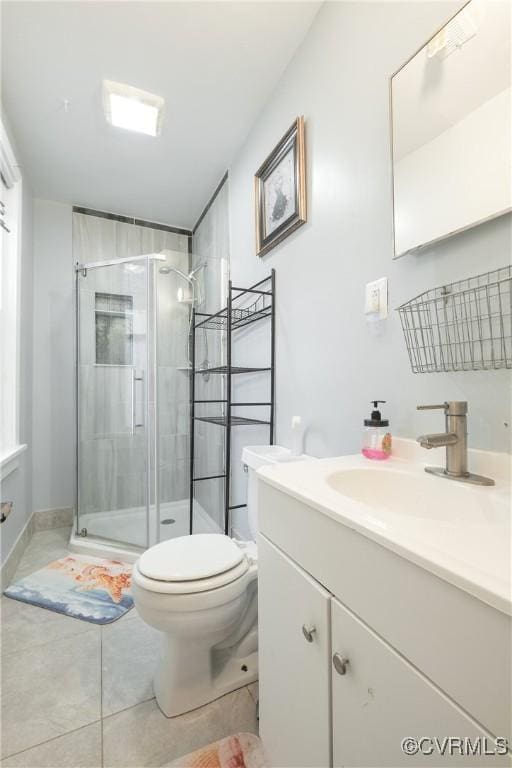 3057 Maury St, Richmond, VA 23224 - bathroom with toilet, a stall shower, vanity, and tile patterned flooring