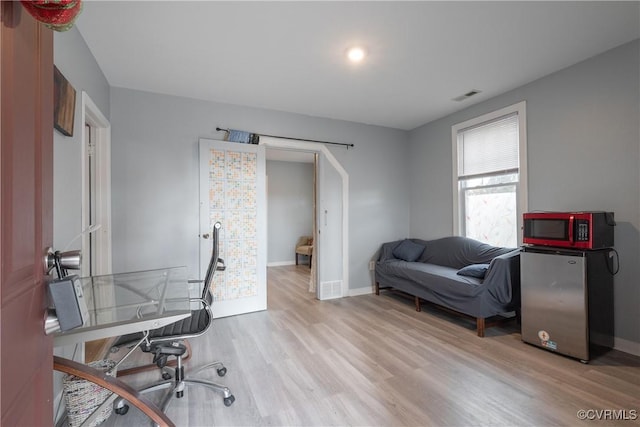 3057 Maury St, Richmond, VA 23224 - office space featuring visible vents, light wood-style flooring, and baseboards