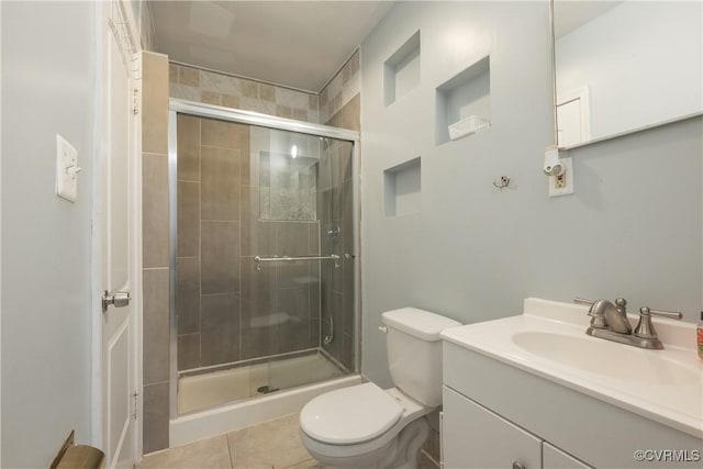 3057 Maury St, Richmond, VA 23224 - full bath with tile patterned flooring, toilet, a shower stall, and vanity