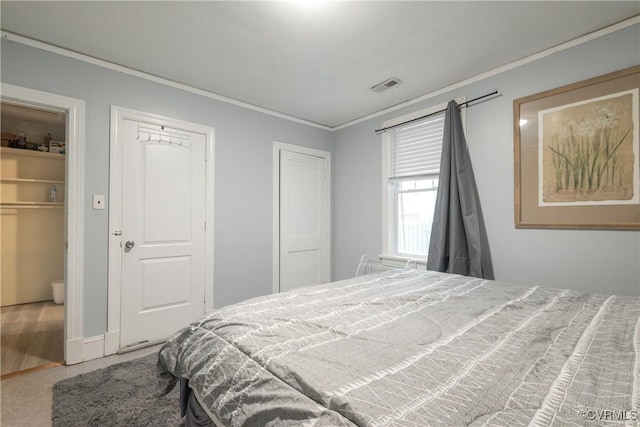 3057 Maury St, Richmond, VA 23224 - bedroom featuring ornamental molding, multiple closets, and visible vents